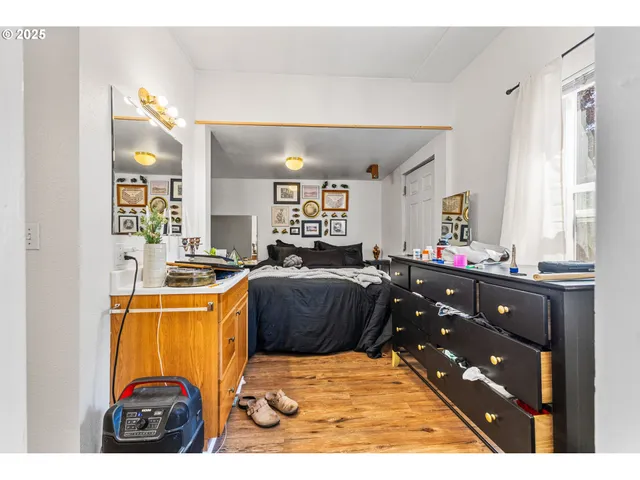 a living room with a couch and dresser