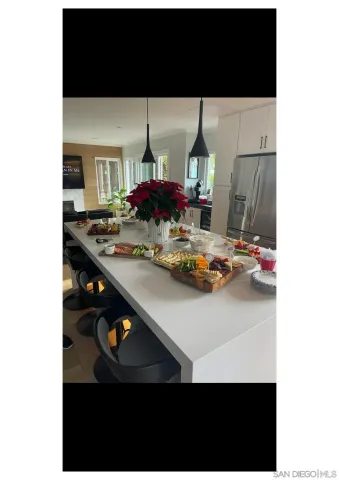 a view of kitchen island with stainless steel appliances