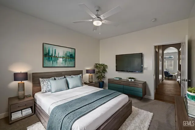 a spacious bathroom with a double vanity sink a toilet and a tub