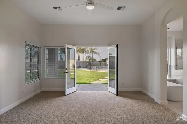 a white bath tub sitting in front of a window