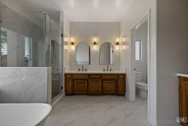 a front view of a house with a yard and seating space