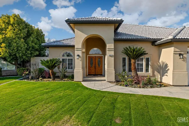 a living room with furniture a fireplace and a table