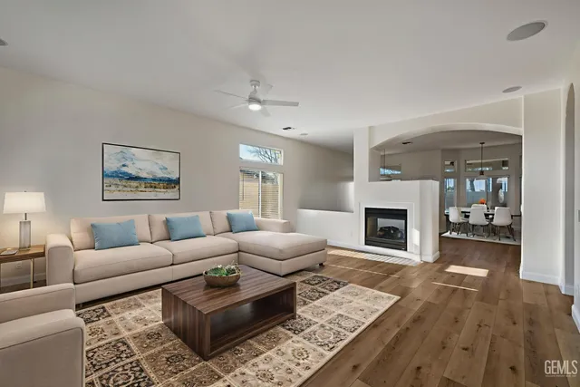 a kitchen with stainless steel appliances a stove a sink and a microwave