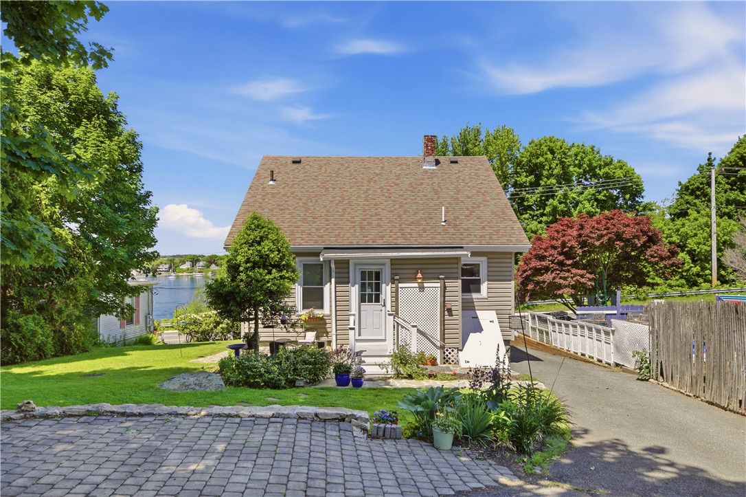 1536 Main Road Tiverton, RI 02878 - Photo 28 of 34 Backyard offers landscaped stonewalls and path, mature perennial gardens, plenty of shade and sundlight and a slate patio