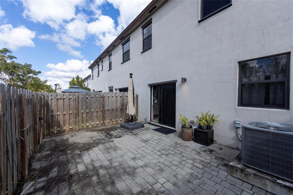 20920 Northeast 8th Avenue Miami, FL 33162 - Photo 15 of 19 a view of a house with backyard and sitting area
