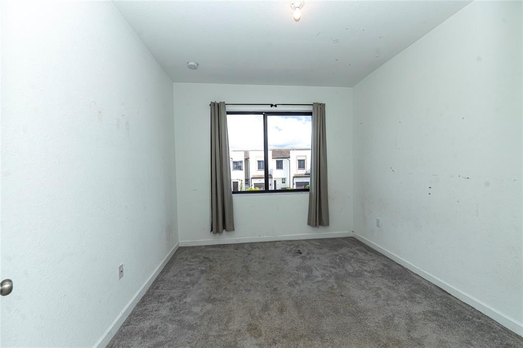 20920 Northeast 8th Avenue Miami, FL 33162 - Photo 19 of 19 an empty room with windows