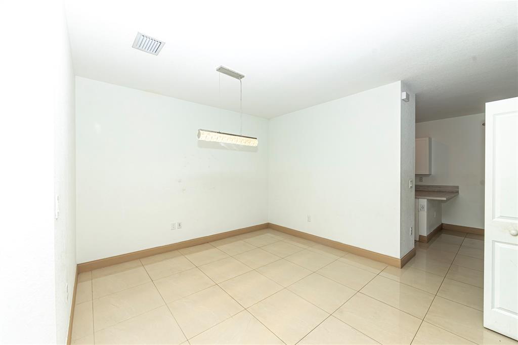 20920 Northeast 8th Avenue Miami, FL 33162 - Photo 7 of 19 a view of a room with a hallway
