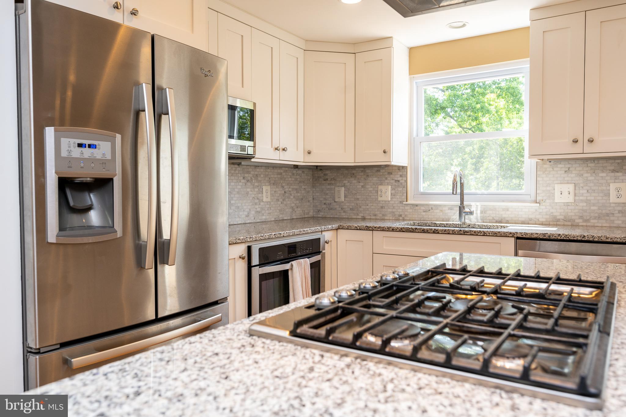 7468 Lone Star Road Lorton, VA 22079 - Photo 14 of 44 Stainless steel appliances & gas cooktop on island