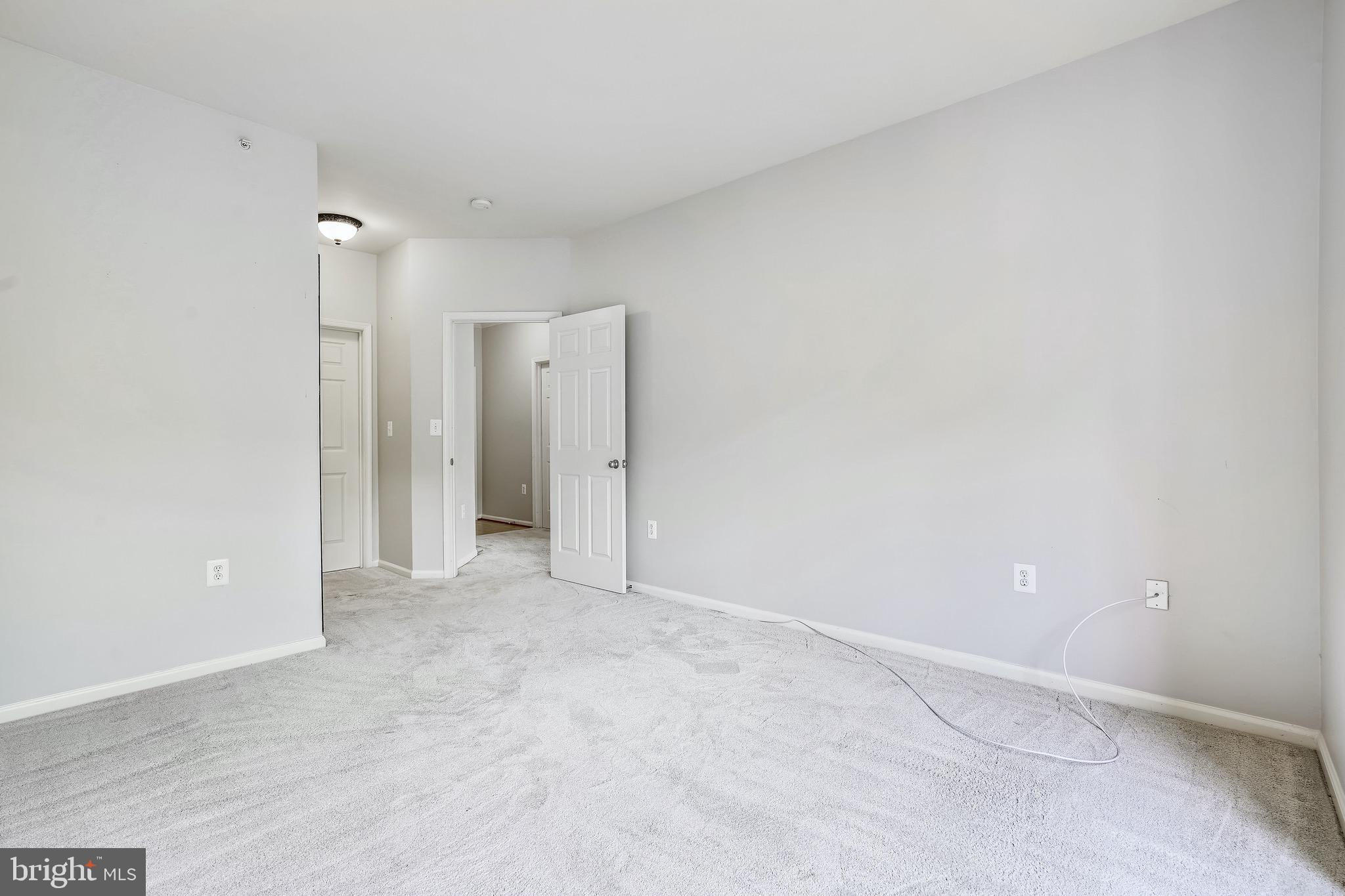 1515 North Point Drive, Unit 301 Reston, VA 20194 - Photo 19 of 32 owners suite with walk-in closet ensuite bath