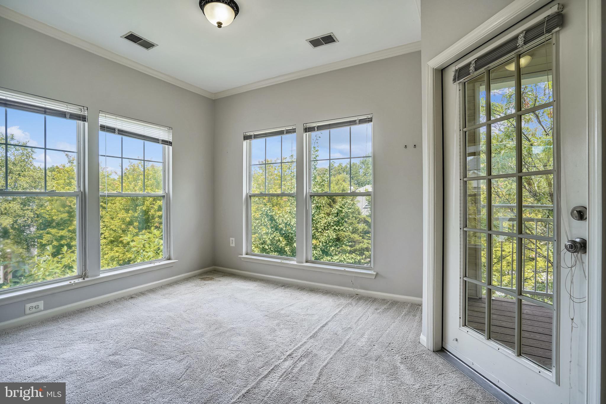 1515 North Point Drive, Unit 301 Reston, VA 20194 - Photo 8 of 32 dining area off LR with balcony access