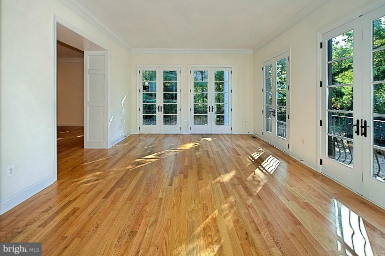 6010 Chesterbrook Road McLean, VA 22101 - Photo 4 of 30 a view of a bedroom with wooden floor and windows