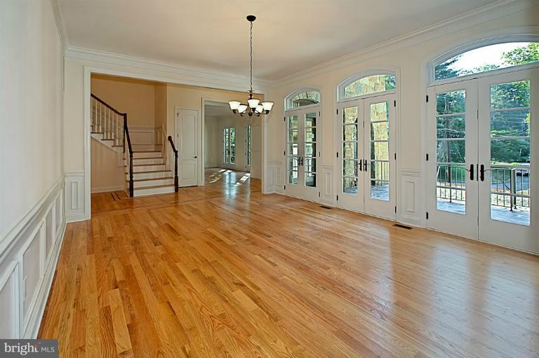 6010 Chesterbrook Road McLean, VA 22101 - Photo 7 of 30 a view of a room with wooden floor chandeliers and outdoor view