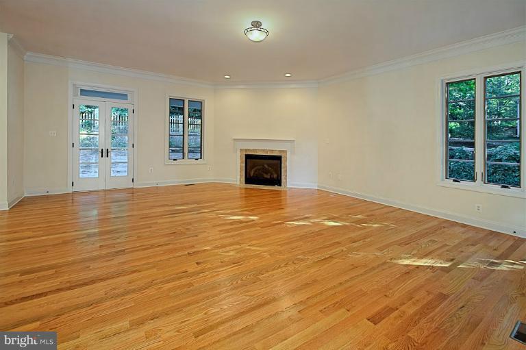 6010 Chesterbrook Road McLean, VA 22101 - Photo 8 of 30 a view of an empty room with a window and wooden floor