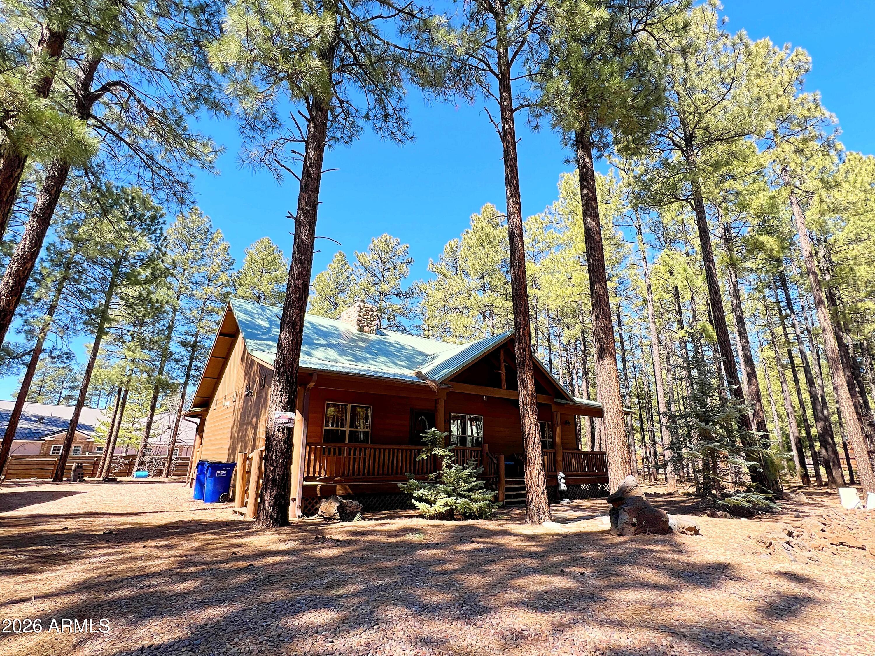 2540 Timber Ridge Lane Pinetop, AZ 85935 - Photo 1 of 37 a view of a building with a tree in the background