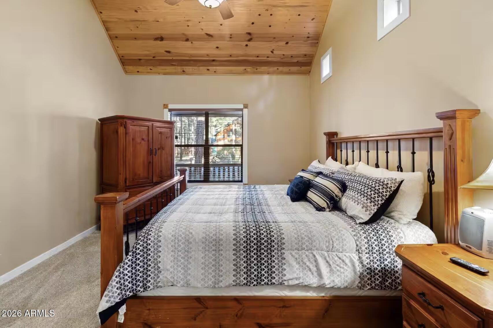 2540 Timber Ridge Lane Pinetop, AZ 85935 - Photo 17 of 37 a bedroom with a bed and wooden floor