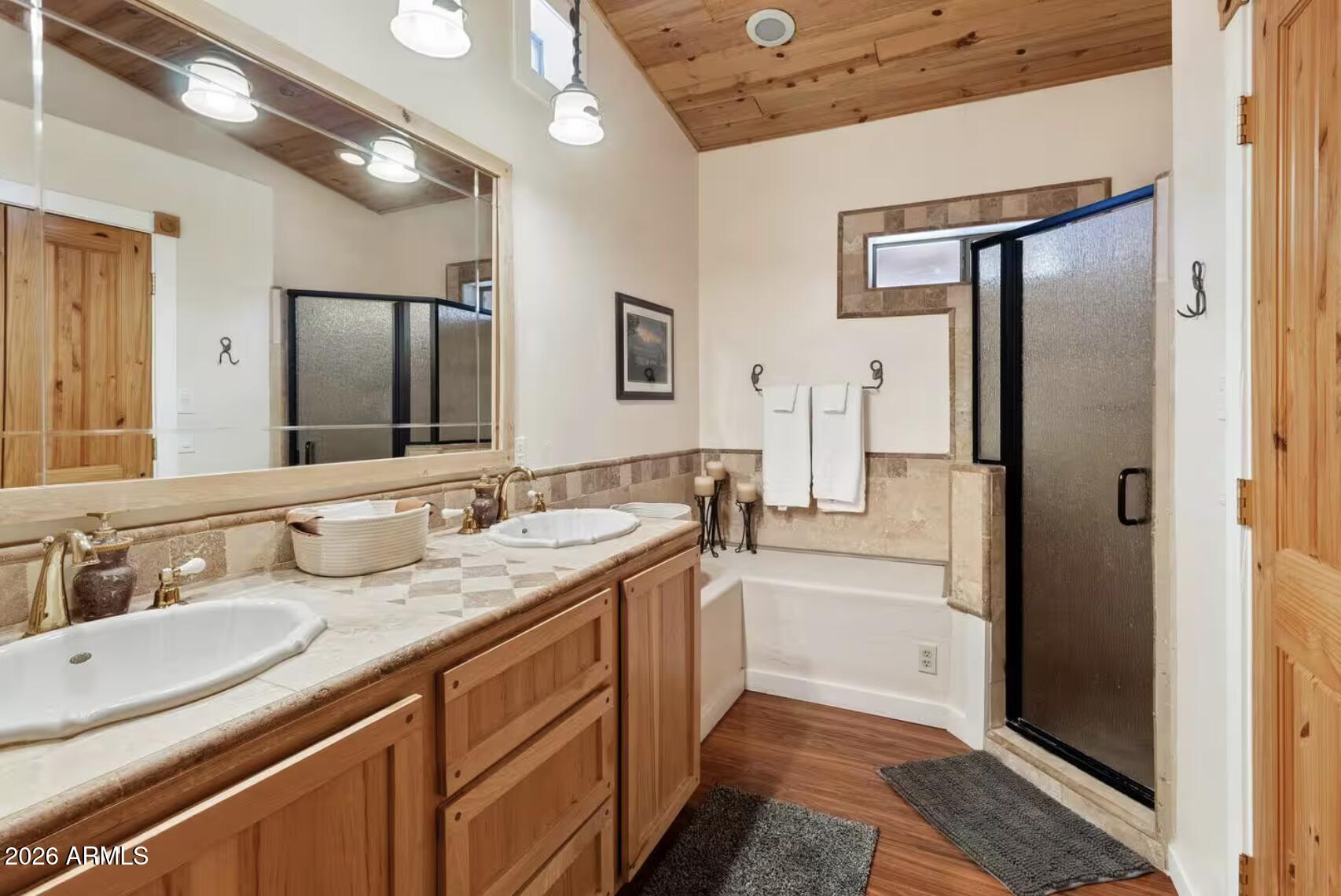 2540 Timber Ridge Lane Pinetop, AZ 85935 - Photo 19 of 37 a bathroom with a granite countertop sink mirror and double