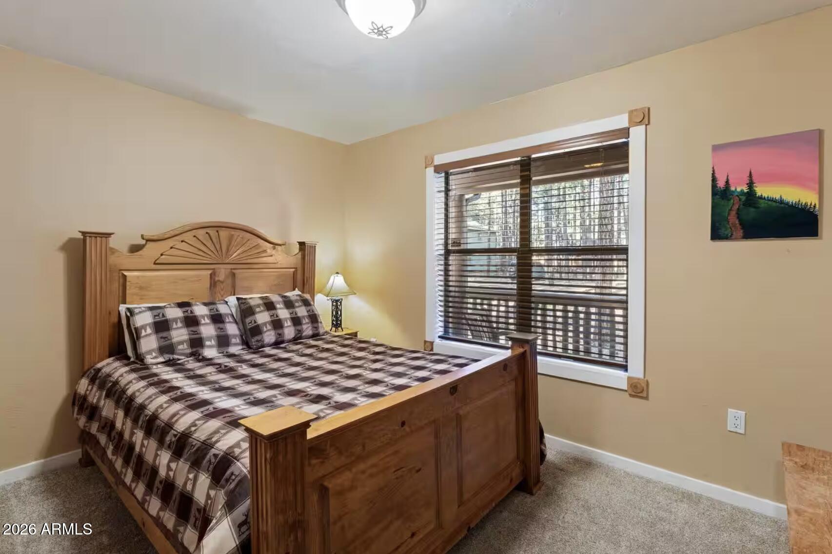 2540 Timber Ridge Lane Pinetop, AZ 85935 - Photo 21 of 37 a bedroom with a bed and a window