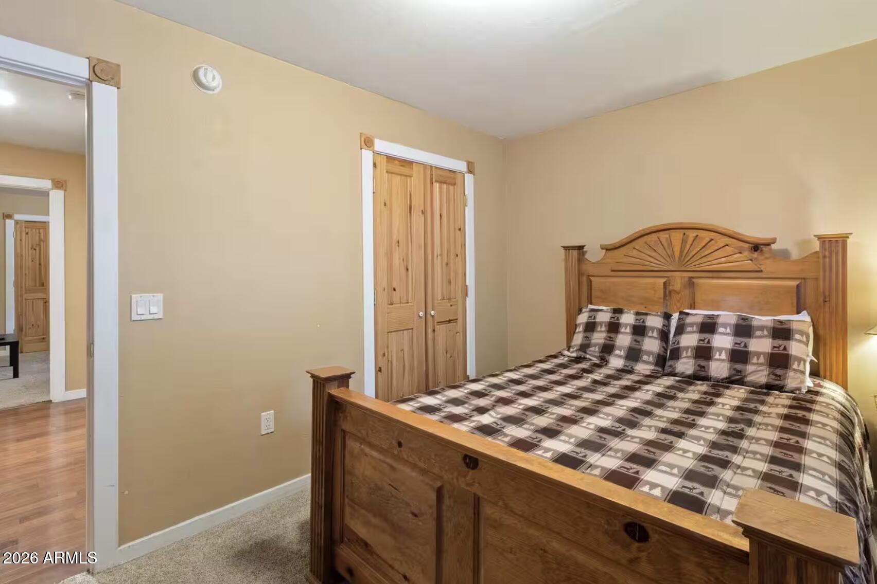 2540 Timber Ridge Lane Pinetop, AZ 85935 - Photo 22 of 37 a bedroom with a bed and dresser