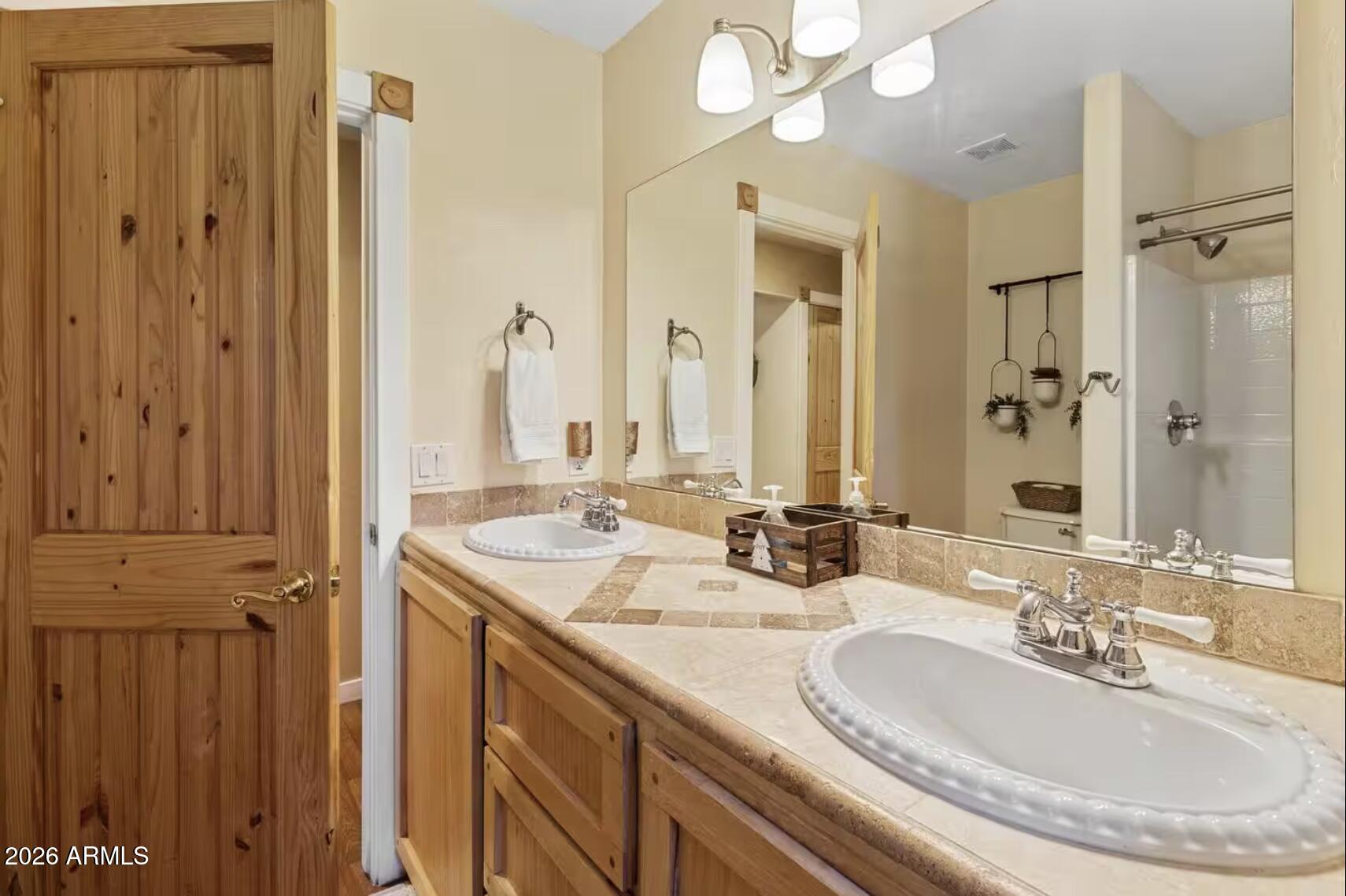 2540 Timber Ridge Lane Pinetop, AZ 85935 - Photo 23 of 37 a bathroom with a double vanity sink mirror and double