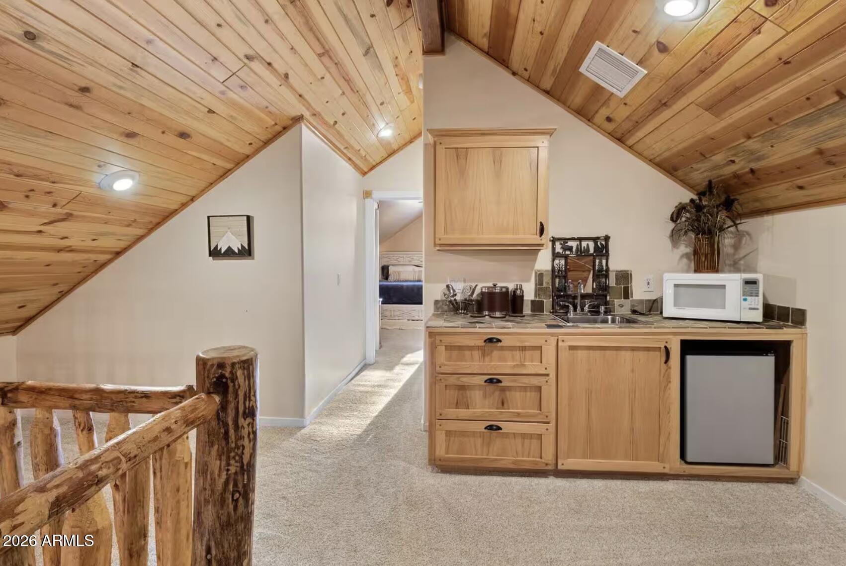 2540 Timber Ridge Lane Pinetop, AZ 85935 - Photo 29 of 37 a kitchen with cabinets appliances and a counter