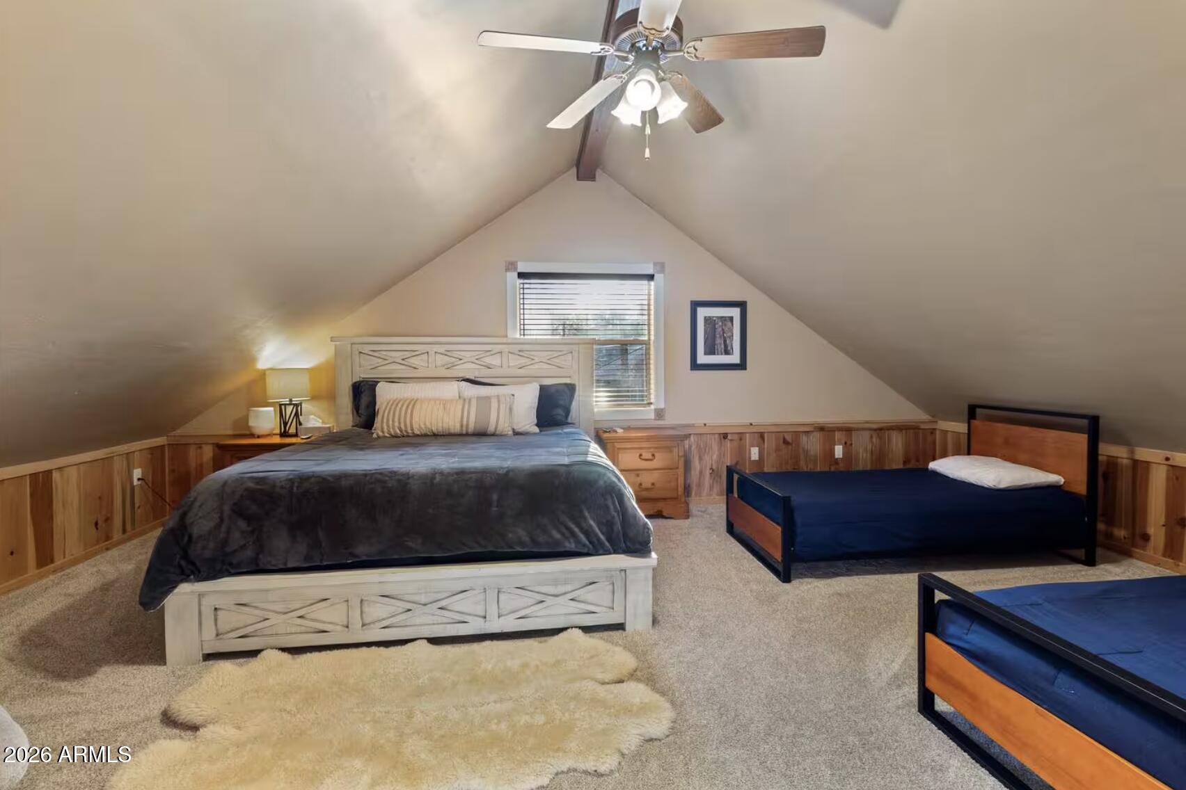 2540 Timber Ridge Lane Pinetop, AZ 85935 - Photo 31 of 37 a bedroom with a bed lamp and a dresser