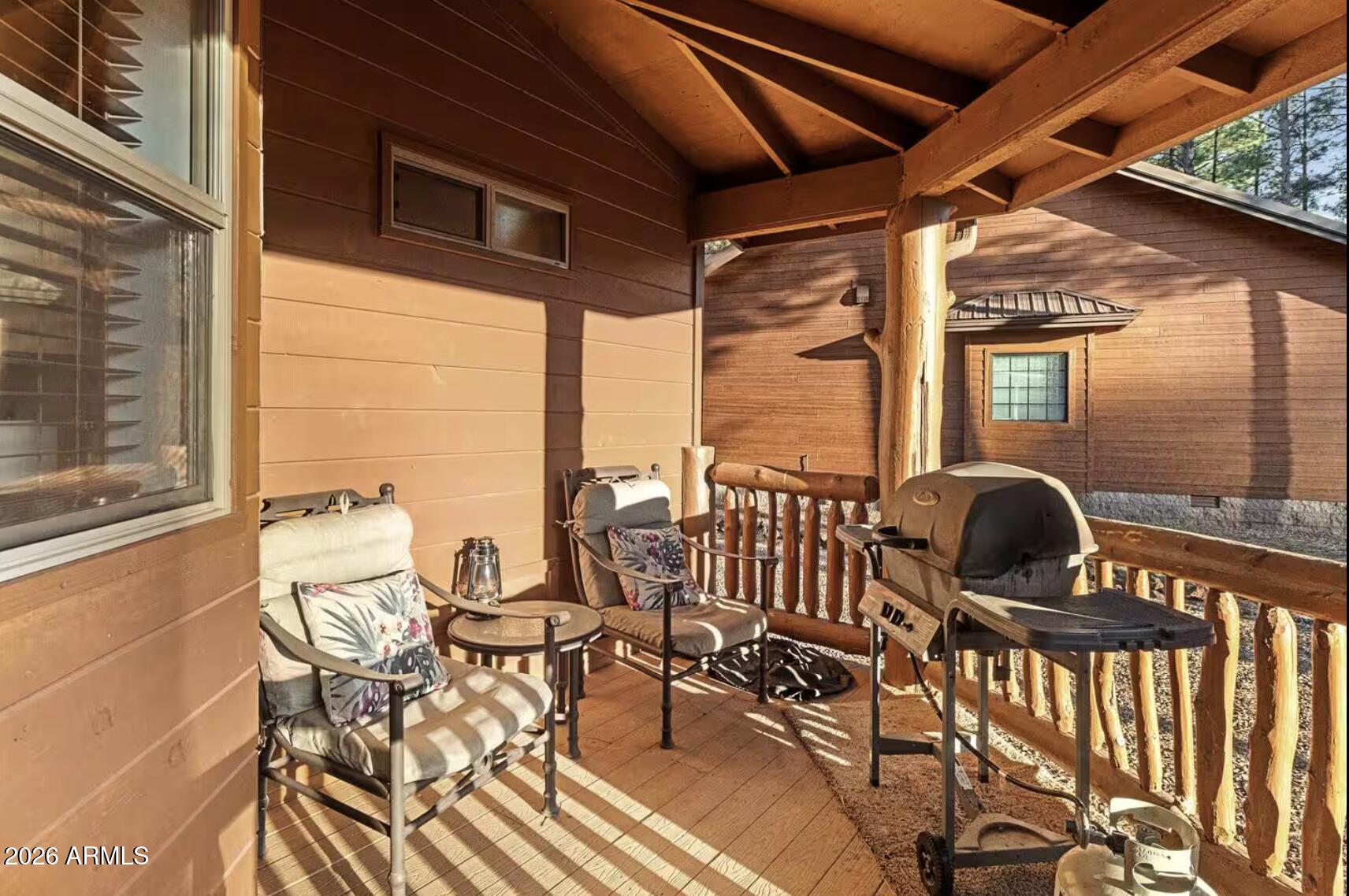 2540 Timber Ridge Lane Pinetop, AZ 85935 - Photo 36 of 37 a view of a balcony with chairs and a table