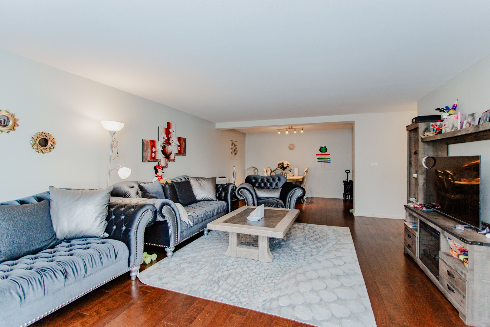 300 Thames Parkway, Unit 1C Park Ridge, IL 60068 - Photo 7 of 19 a living room with furniture and a flat screen tv