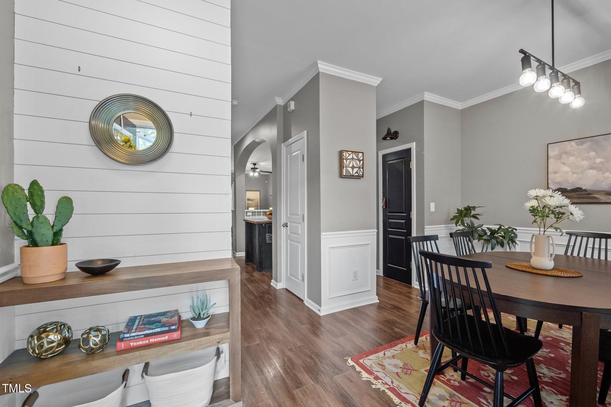 214 Cedar Elm Road Durham, NC 27713 - Photo 10 of 35 a dining room with a wooden table a table and chairs