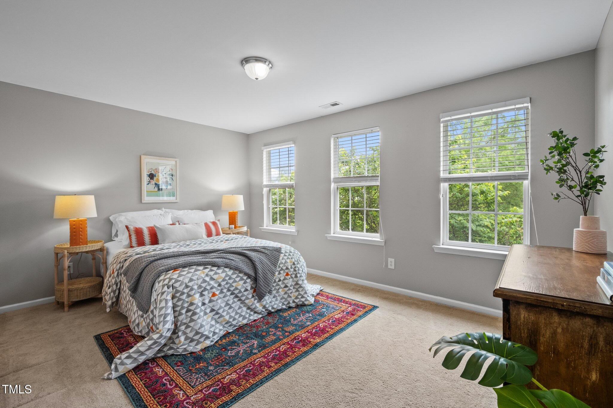 214 Cedar Elm Road Durham, NC 27713 - Photo 21 of 35 a bed room with a bed and a window