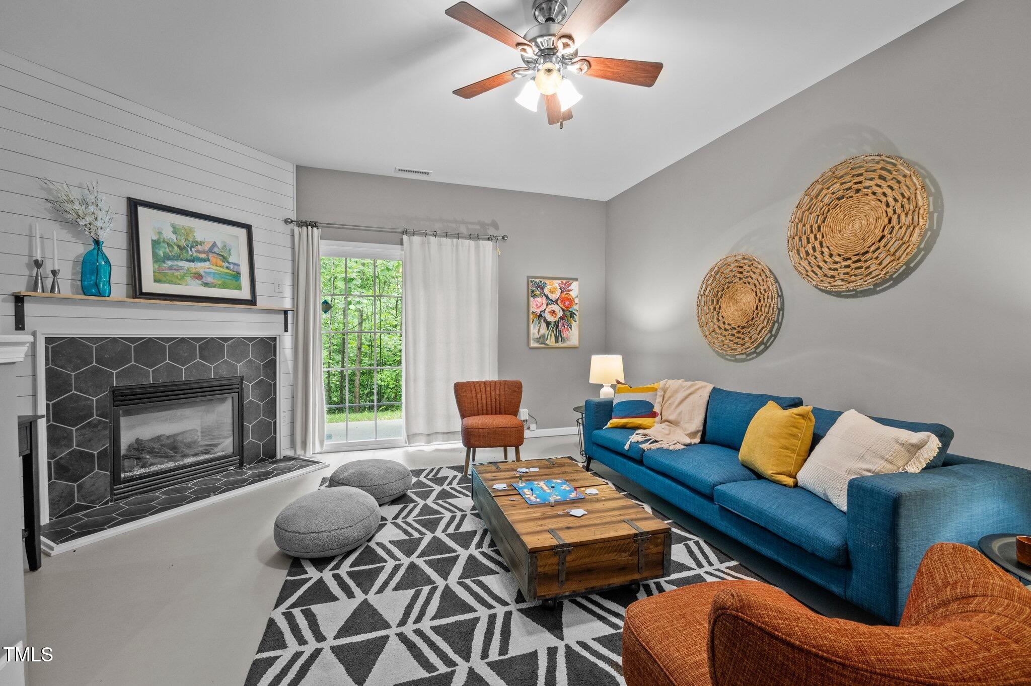 214 Cedar Elm Road Durham, NC 27713 - Photo 25 of 35 a living room with furniture and a fireplace