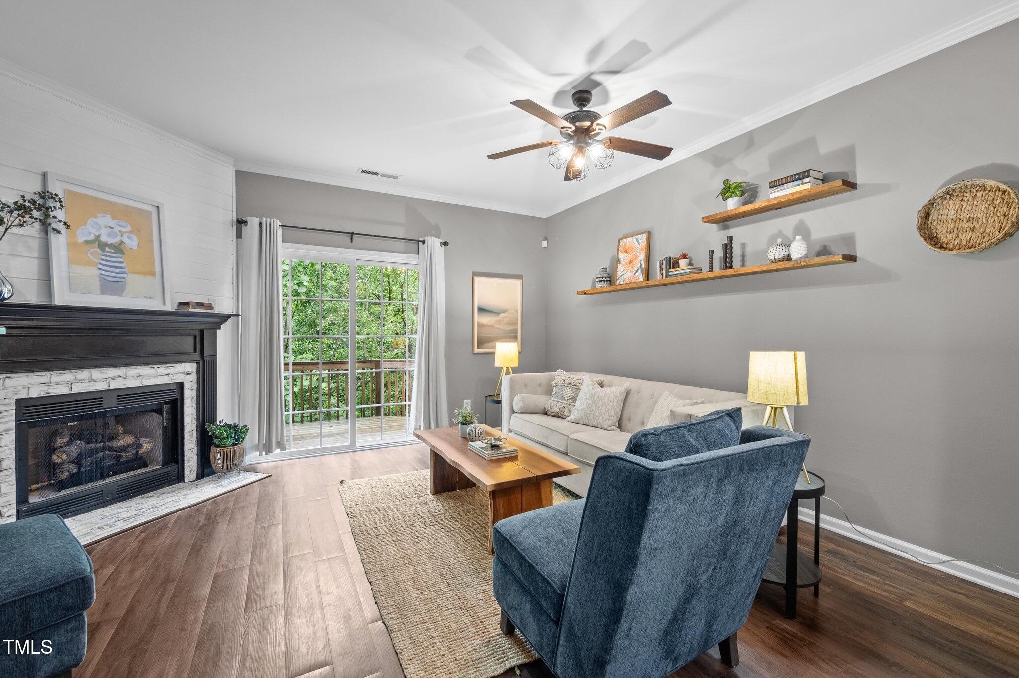 214 Cedar Elm Road Durham, NC 27713 - Photo 5 of 35 a living room with furniture and a fireplace