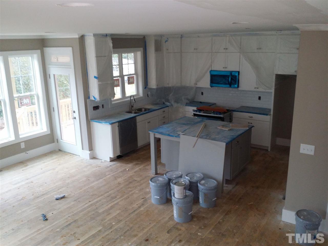 805 Edmund Street Raleigh, NC 27604 - Photo 11 of 13 a kitchen with a sink and a stove