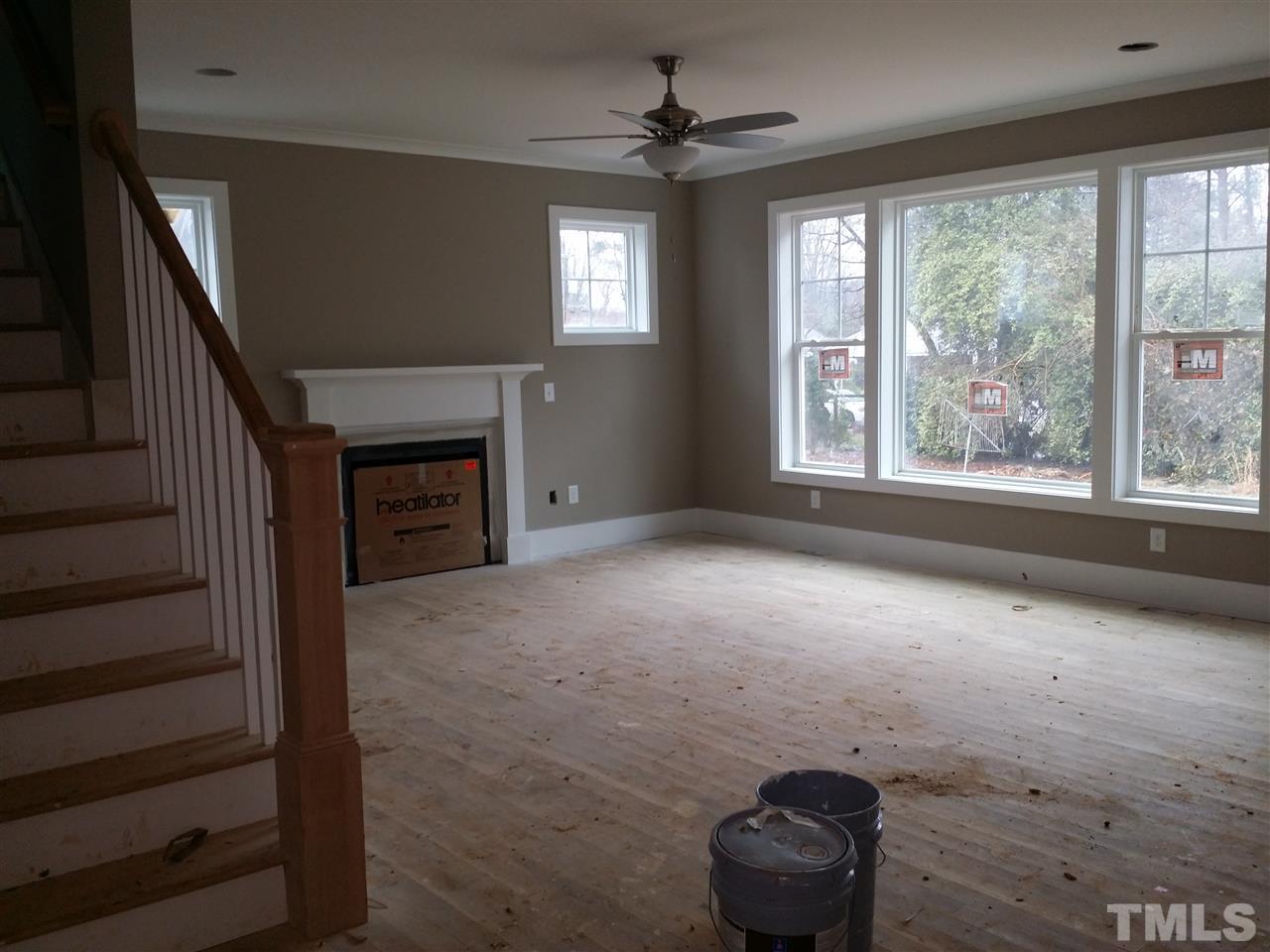 805 Edmund Street Raleigh, NC 27604 - Photo 12 of 13 a view of an empty room with a fireplace and a window