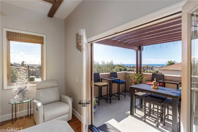 a outdoor living space with furniture and a floor to ceiling window