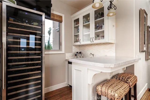 a view of a kitchen with furniture and entryway