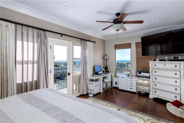 a bed room with furniture and flat screen tv