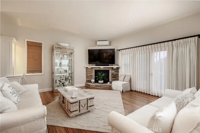 a living room with furniture fireplace and a flat screen tv