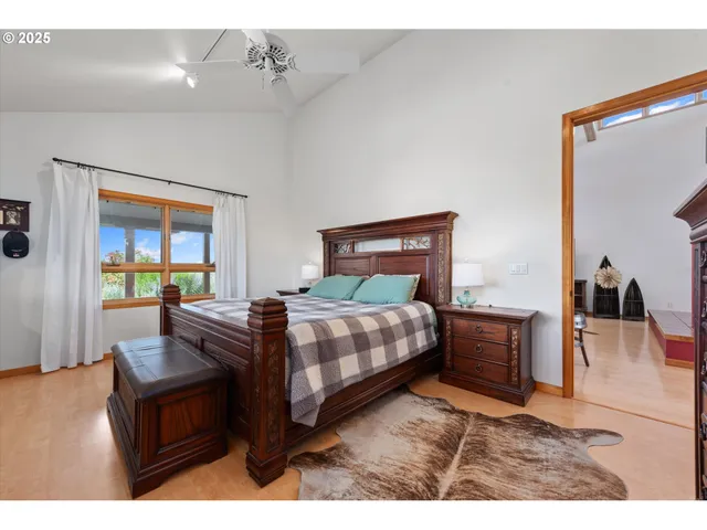 a bedroom with a bed window and couch