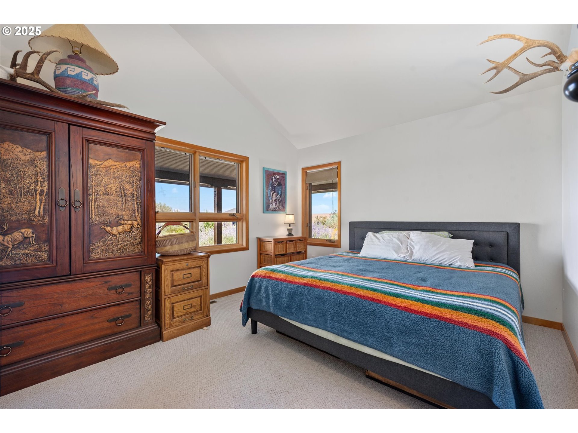 64209 Meadow Brook Road Lexington, OR 97839 - Photo 21 of 48 a bedroom with a bed and with cabinets