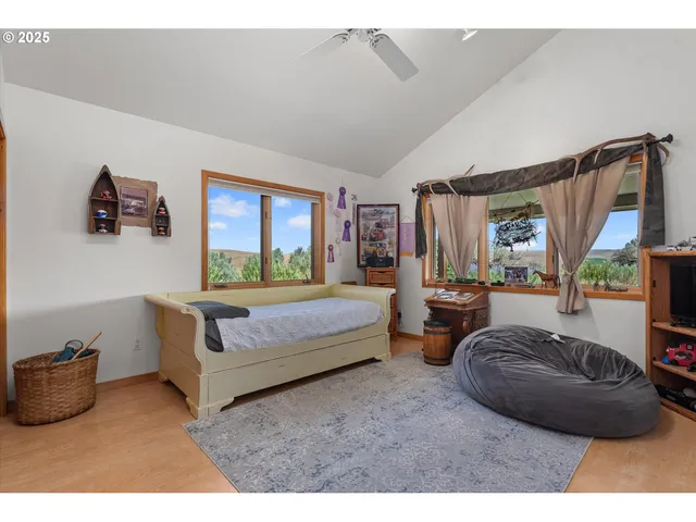 a bedroom with bed and window