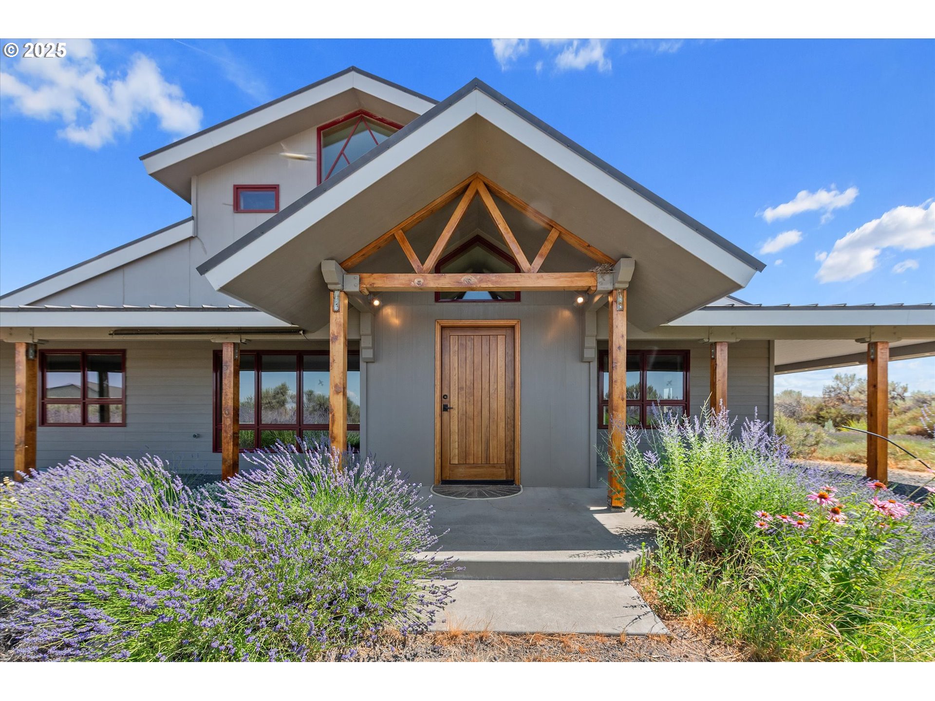 64209 Meadow Brook Road Lexington, OR 97839 - Photo 4 of 48 a front view of a house with garden