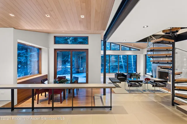 a large white kitchen with a large window