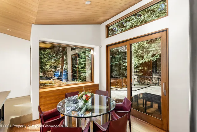 a bedroom with a large bed and a bookshelf