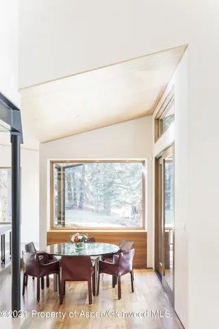 a bedroom with a large bed and a large window