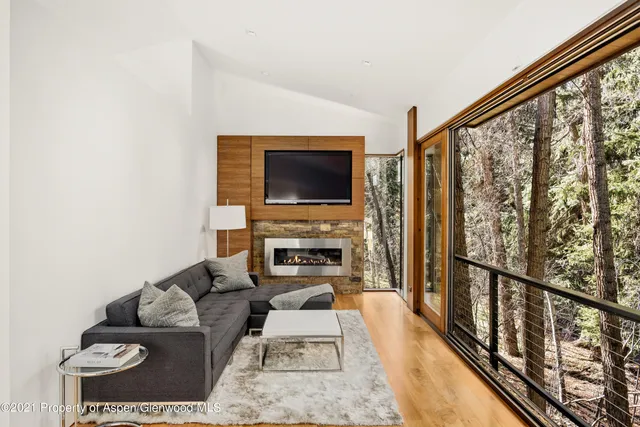 a backyard of a house with lots of green space and outdoor seating