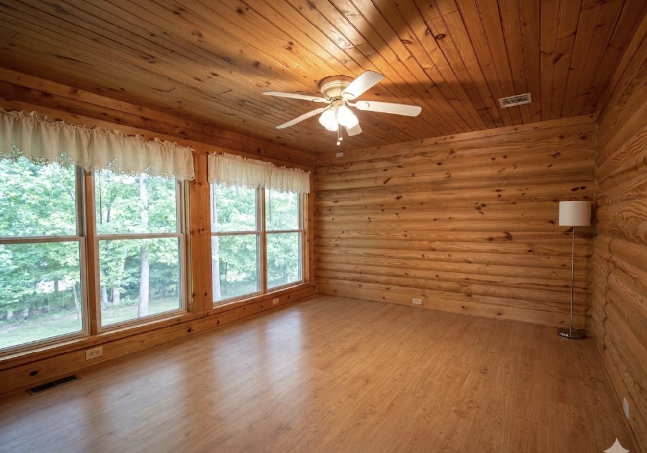 33315 Fulshear Farms Road Fulshear, TX 77441 - Photo 17 of 19 a view of room with window and wooden floor