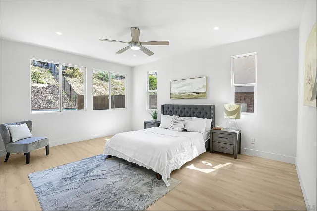 a bathroom with a double vanity sink mirror and shower