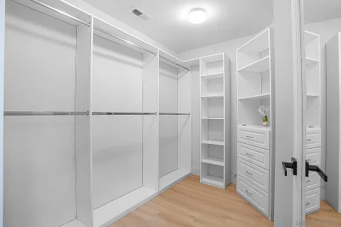a bathroom with a double vanity sink and mirror