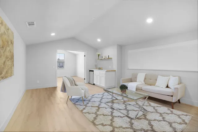 a bathroom with a granite countertop sink a toilet and a mirror