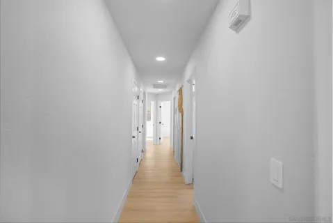 a white toilet sitting next to a shower